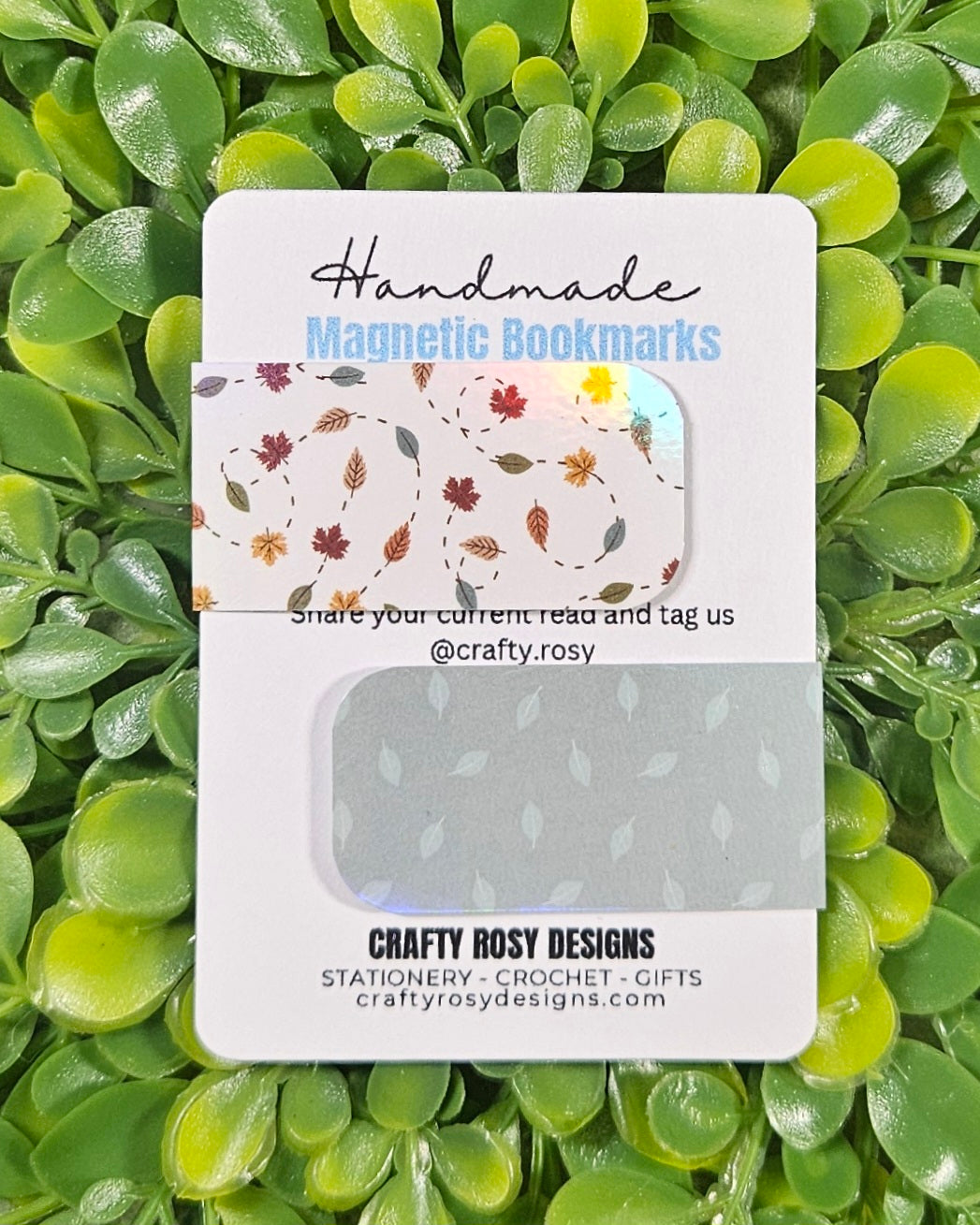 Handmade magnetic bookmarks with leafy designs packaging on a green leaf background