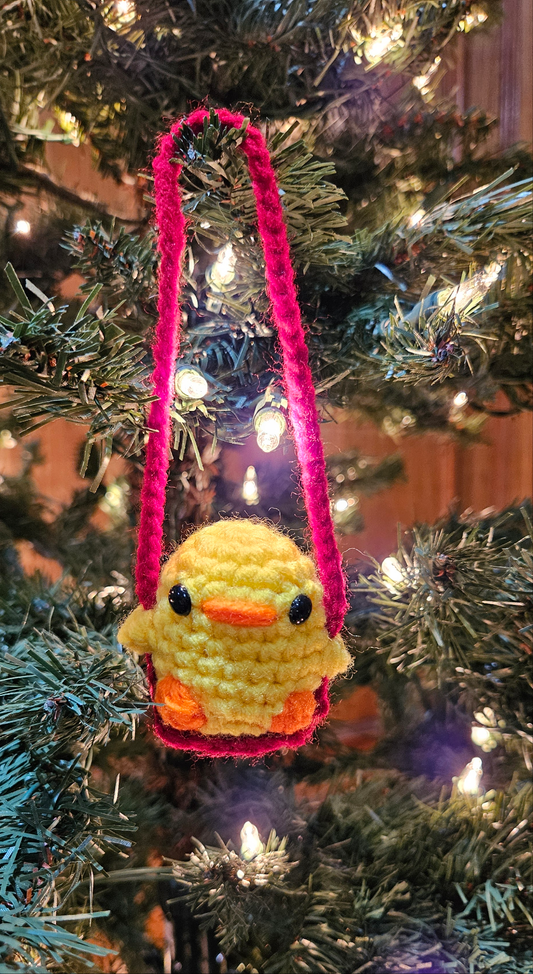 Crochet duck on swing