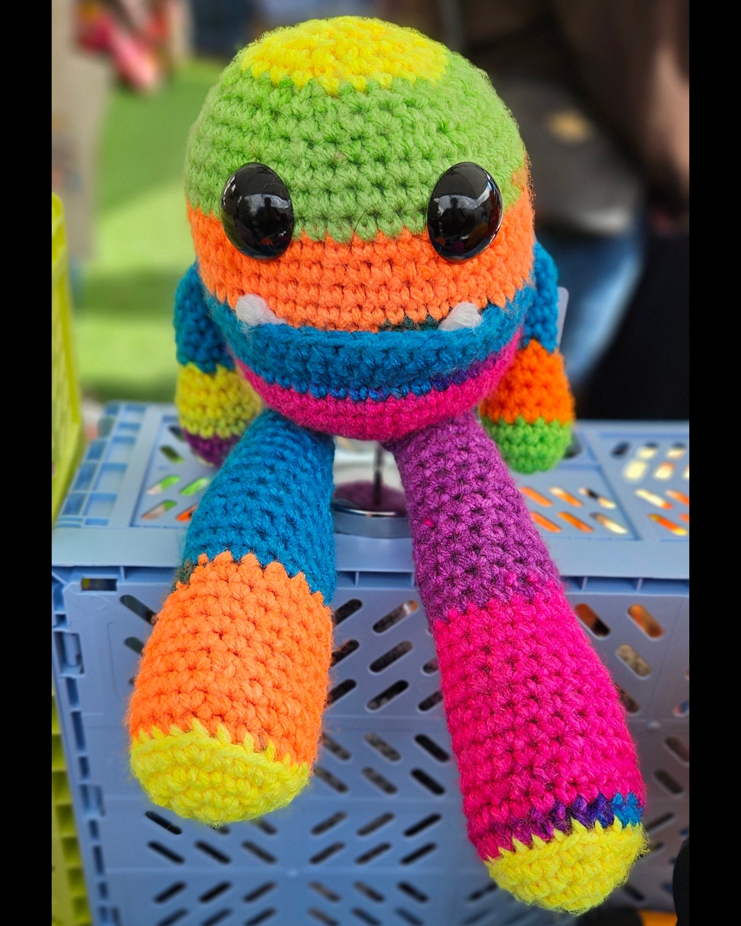 Colorful crochet toy with a striped pattern